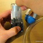 Insert the other end into the suction port of the pump.